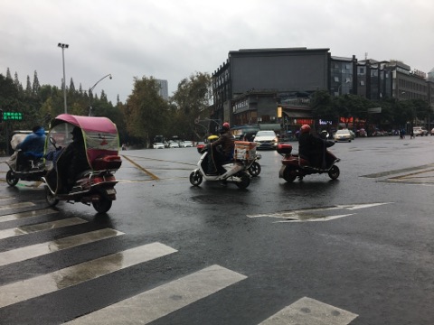 moped at a crossroads