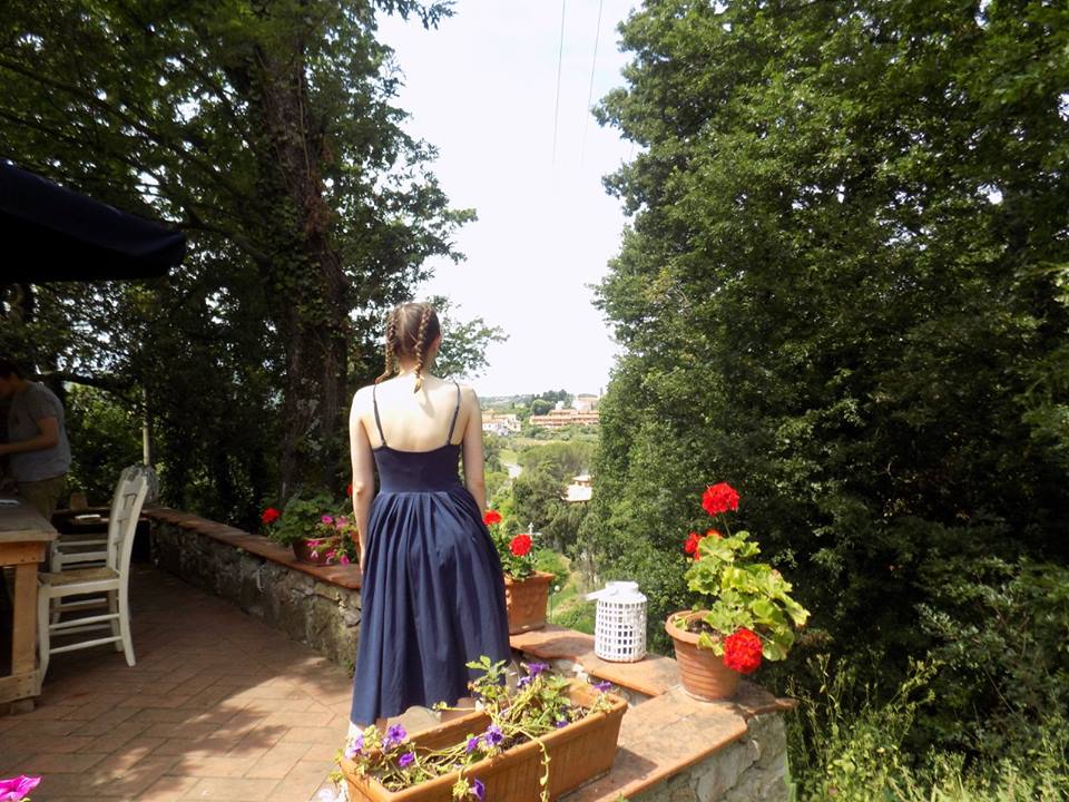 woman in dress staring at view